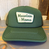 Forest green foam trucker cap with tree graphic and recycled mesh back, suitable for outdoor or casual use.