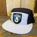 Black and grey nylon cap with UFO patch, designed for casual wear.