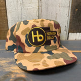 Camo 5-panel cotton work hat with adjustable back; durable design suitable for outdoor or casual use.