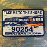 Embroidered patch with pier, waves, sunset; features Take Me to the Shore, 90254. Suitable for jackets or bags.