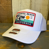 White high-crown trucker hat featuring a patch with wave, sun, and birds; mesh back for casual outdoor wear.