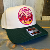 Dark green and natural 5-panel cotton cap with Joshua Tree National Park design, displayed on a wooden surface.