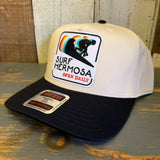 Black and natural 5 panel cap with a surfer patch, designed for casual wear.