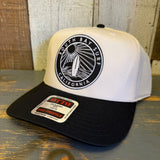 Black and natural 5-panel cap with a black patch and surfboard graphic, suitable for casual or beachwear use.