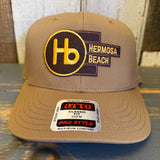 Wheat brown 5-panel cap made of fabric, featuring a logo patch and OTTO Pro Style sticker on the brim.
