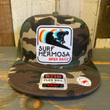 Camo snapback hat with a patch, made from durable fabric in a classic 6-panel, mid-profile design for everyday wear.