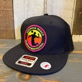Black 6-panel snapback cap with a colorful volleyball patch, suitable for casual or sportswear.