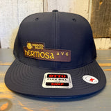Black 6-panel snapback hat with front patch and brim stickers, designed for everyday casual wear.