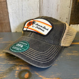 Black and khaki mesh trucker cap with a sunset patch, designed for casual wear.