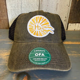 Black six-panel trucker cap with mesh back, sunburst logo, and OFA visor sticker, suitable for casual wear.