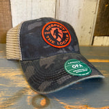 Trucker cap with navy field camo front, brown brim, mesh back, and Respect the Locals patch.