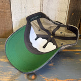 Six-panel trucker cap with navy field camo front and brown mesh back; designed for casual, everyday wear.