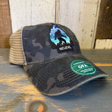Mesh-back trucker cap in black and white with BELIEVE text across the front; suitable for casual wear.