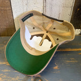 Brown and khaki trucker cap displayed inside-out on a rustic wood surface, showing mesh and inner construction.