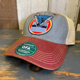 Light blue and cardinal six-panel trucker cap with mesh back and volleyball patch, ideal for breathable athletic wear.