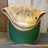 Light blue and cardinal trucker cap with green brim, mesh back, and adjustable snapback closure.