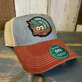Six-panel trucker cap with an owl patch, mesh back, and adjustable snap closure, suitable for casual outdoor use.