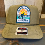 Olive green corduroy cap with 1 to 3 FEET HIGH & RISING patch and an Opto sticker on the brim.