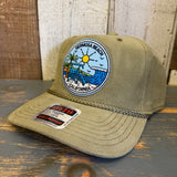 Olive corduroy cap featuring a CA patch, palm trees, waves, and lifeguard tower; casual sun protection.