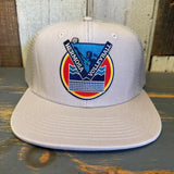 6-panel trucker hat in faded bone with volleyball sunset patch, mesh back, and vintage-wash cotton front.