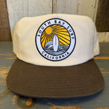 Two-tone Java and natural workhorse hat with multi-color patch and snapback closure, ideal for casual or outdoor wear.