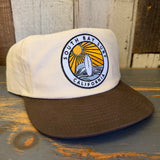 Two-tone workhorse hat with a multicolor patch and snapback closure, suitable for casual wear.
