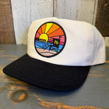 Two-tone black and natural adjustable snapback hat with a sunset patch, ideal for casual outdoor wear.