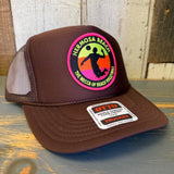 Brown mesh trucker hat with a Mecca of Beach Volleyball patch, ideal for sun protection and casual beachwear.