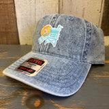 Light blue denim dad hat with a multicolored lifeguard tower patch on the front, suitable for casual wear.