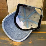 Light denim dad hat, inside view shows stitching detail and black sweatband; casual headwear for sun protection.