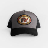 Black hat with gray/black mesh back and motorcycle graphic patch; designed for casual wear.