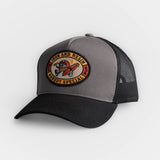 Black cotton twill hat with mesh back and motorcycle patch graphic. Durable for casual or outdoor use.
