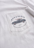 White cotton pocket t-shirt featuring a bold graphic on the front; casual, everyday wear.