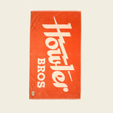 Orange towel with white text on a beige background