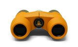 Waterproof orange and green binoculars with textured grips, durable plastic, kid-friendly, shown from the front.