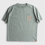 Aqua cotton pocket tee with subtle light orange graphic, designed for casual everyday wear.