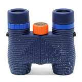 Waterproof binoculars with black ridged grips and an orange adjustment knob, designed for travel and outdoor use.