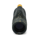 Black and gold textured object on a white background