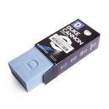 Blue rectangular bar soap partially visible in a dark box, intended for bathing and personal hygiene use.