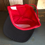 Black and red 5-panel cap seen from above, featuring a red interior and black underbill; casual wear accessory.
