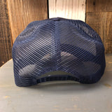 Navy 5-panel mesh-back cap with white rope detail, viewed from the back on a wooden surface.