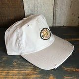 Stone-colored vintage wash dad hat with a cactus patch and “Plan for Adventure” text, suitable for outdoor wear.