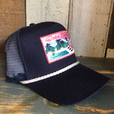 Navy and white 5-panel cap with mesh back and rope detail, displayed on a rustic wooden surface.