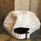 Stone-colored cotton dad hat with adjustable strap and metal buckle, shown from the back.