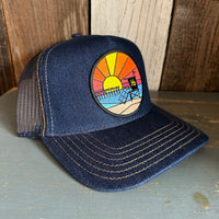 Hermosa Beach OBLIGATORY SUNSET Premium Denim Trucker Hat - Navy/Gold Stitching
