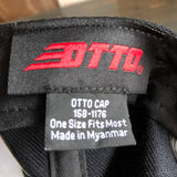 Gray fabric 5 panel hat label showing size One Size Fits Most and origin Made in Myanmar.