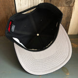 Black 5-panel snapback hat with a mid profile, made of durable fabric; suitable for everyday casual wear.