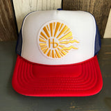 Trucker hat with red, white, and royal blue panels, mesh back, and adjustable snapback closure.